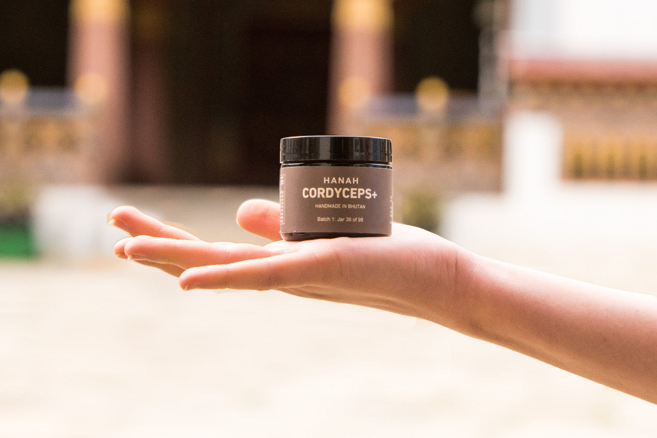 HANAH Cordyceps+ jar, a blend of cordyceps sinensis and 8 other adaptogenic herbs all from the mineral rich lands of Bhutan