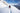 American professional snowboarder Travis Rice wades through snow up to his thighs 